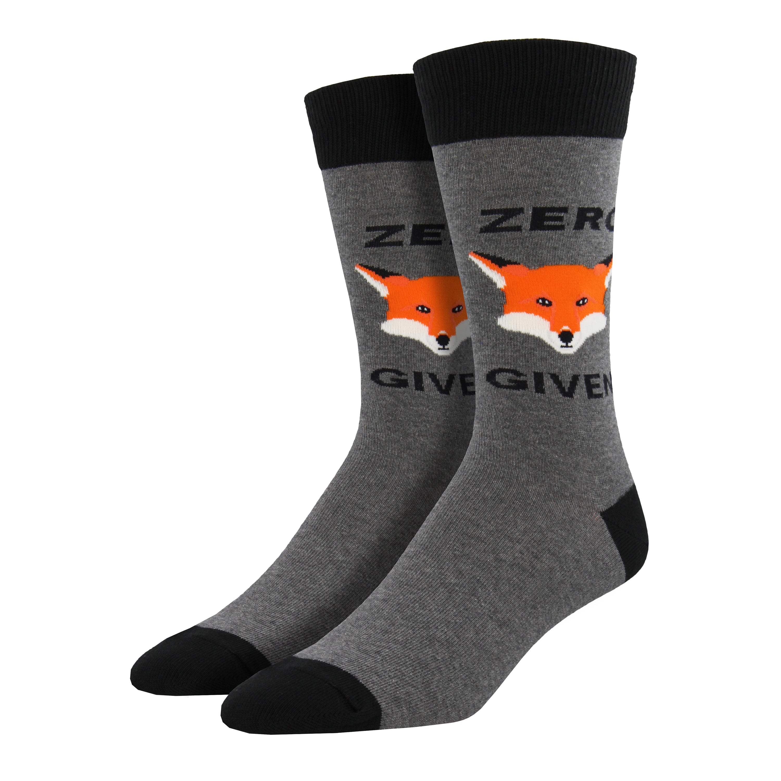 Shown on leg forms, a pair of Socksmith brand men's cotton crew socks in grey with black heel/cuff/toe and a cartoon fox face on the leg. The text on the sock reads, 