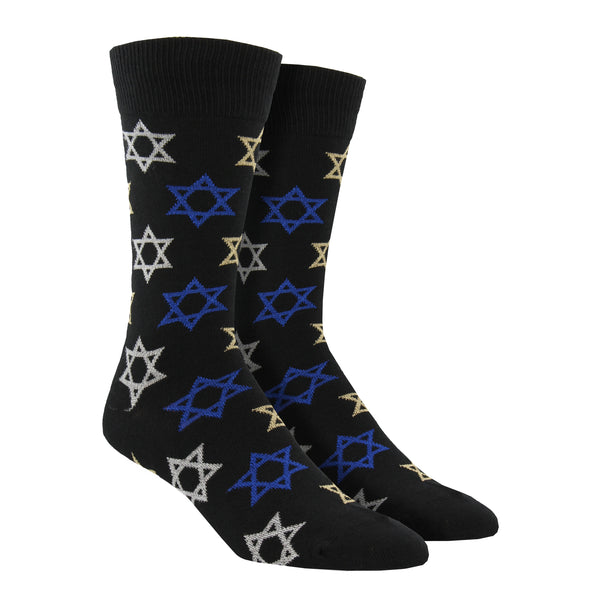 Shown on leg forms, a pair of men's Socksmith brand cotton crew socks in dark blue with blue, white, and yellow Stars of David all over the sock.