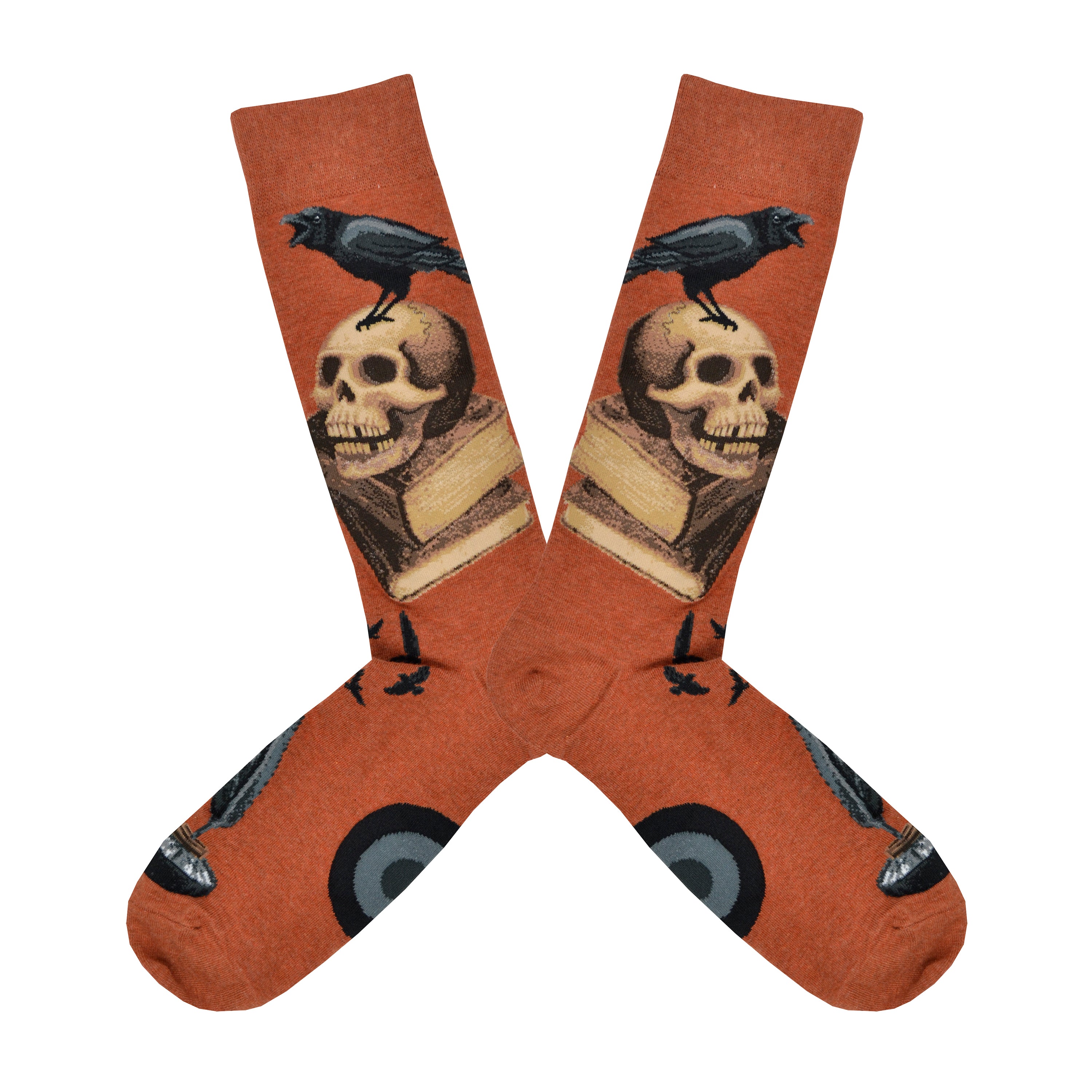 Shown in a flatlay, a pair of Mod Socks’ warm brown cotton men's crew socks with a stack of books, skull, and raven