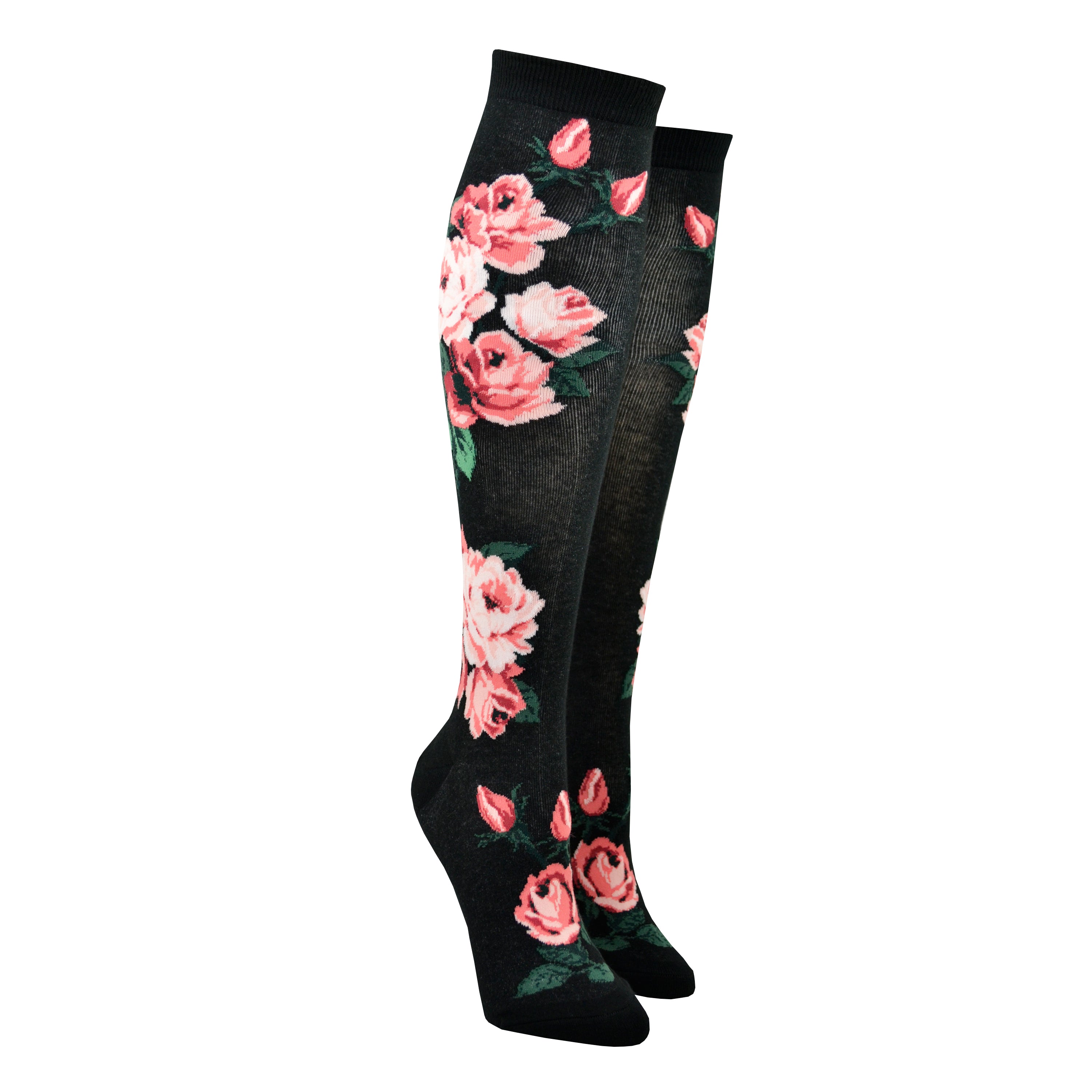 A pair of women's cotton knee high socks by Modsock feature bright pink roses on a black background and are shown on a mannequin leg form.