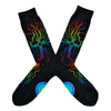 Shown in a flatlay, a pair of Mod Socks’ black cotton men's crew socks with a rainbow computer motherboard pattern