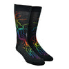 Shown on a foot form, a pair of Mod Socks’ black cotton men's crew socks with a rainbow computer motherboard pattern