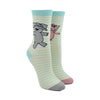  Shown on a leg form, these cream cotton unisex crew socks with a contrasting gray and pink toe, blue cuff, and blue thin stripes by the brand Out of Print feature a gray elephant on one leg and a pink pig on the other leg.