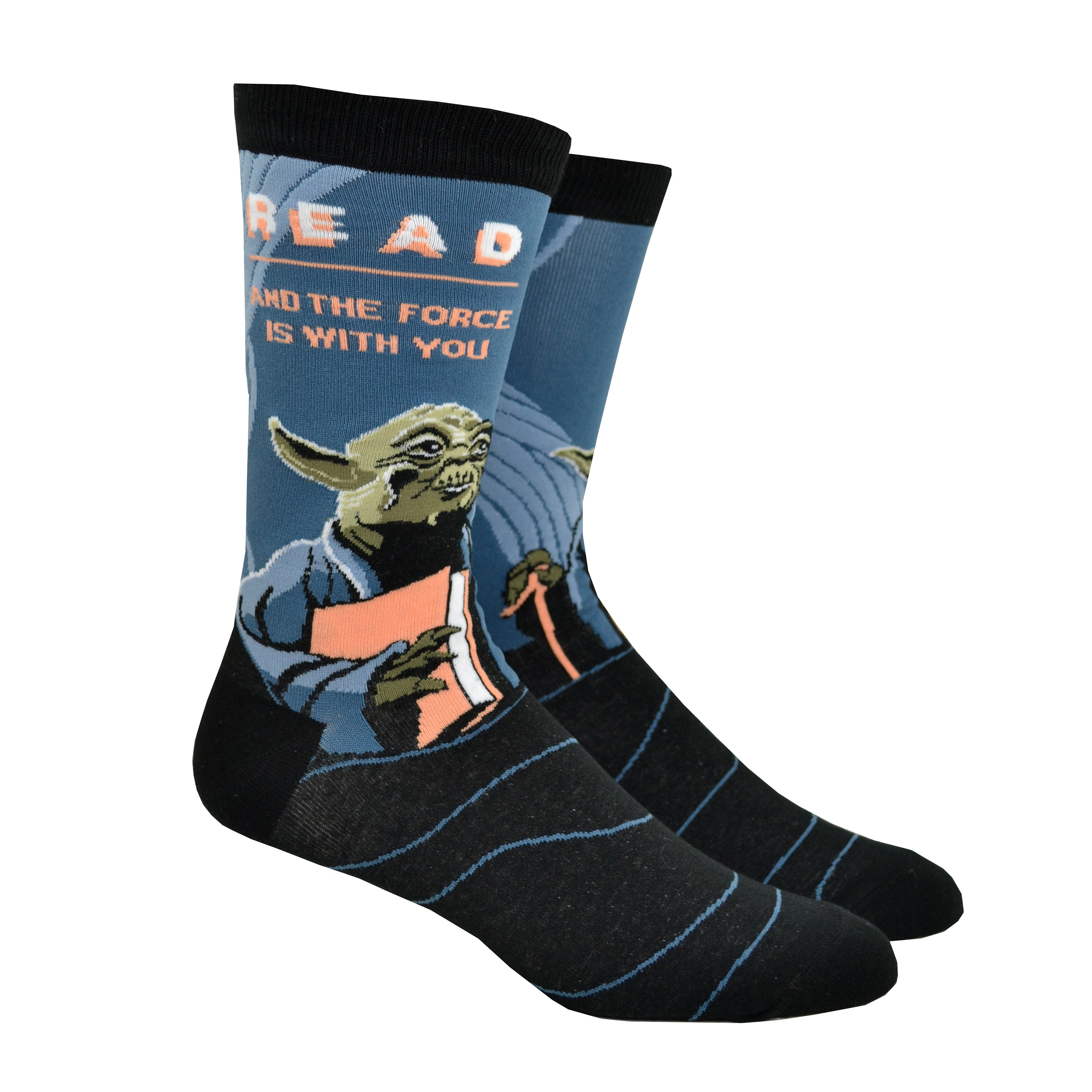 Shown on a foot form from another angle, a pair of unisex Out of Print blue cotton crew socks with black cuff/heel/toe, white “READ: And The Force Is With You” text, and old Yoda holding book portrait