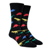 Shown on a foot form, a pair of Socksmith's black cotton men's crew socks with multicolor dinosaur shape pattern