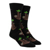 Shown on a foot form, a pair of Socksmith's black cotton men's crew socks with chill sloths hanging from vibes