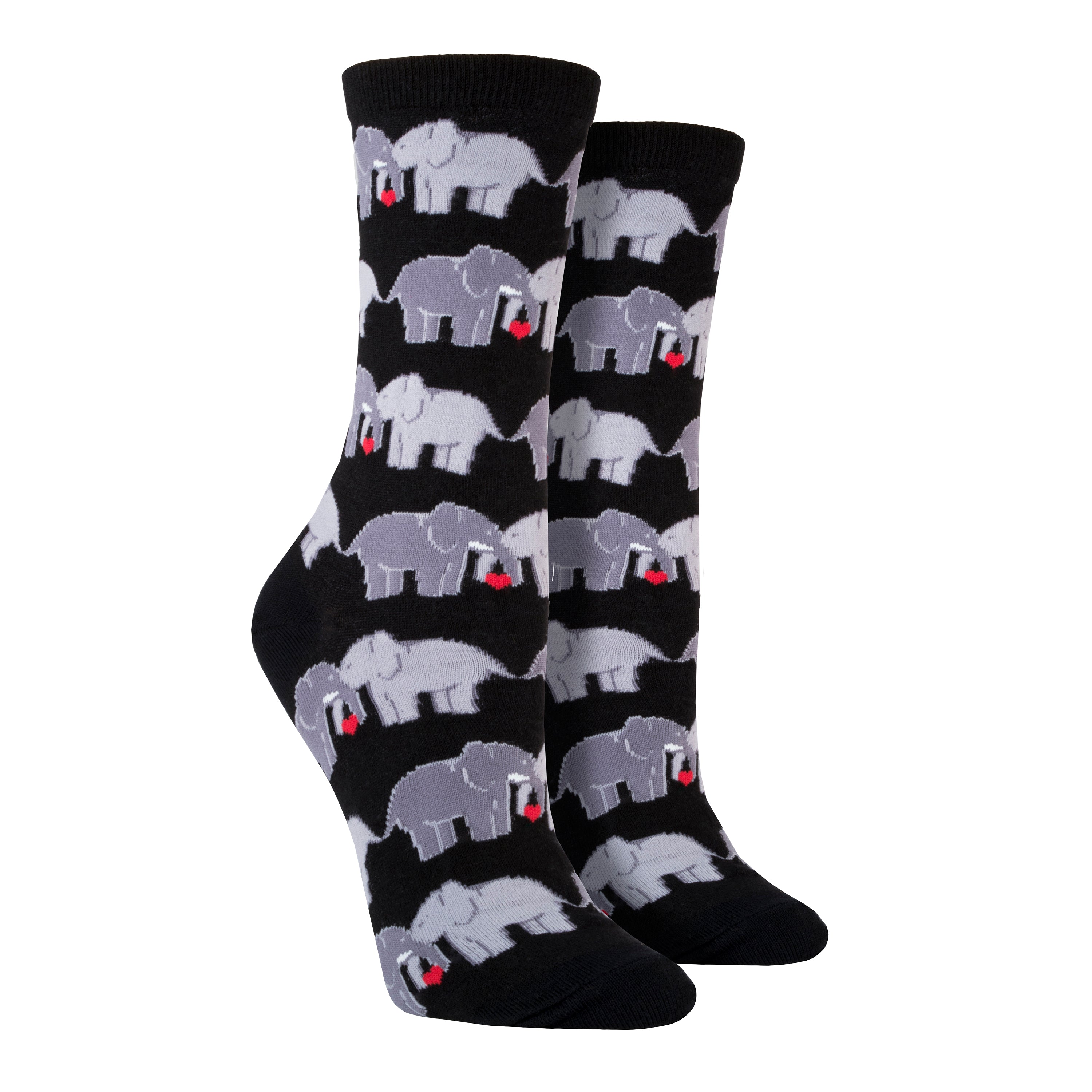 Shown on leg forms, a pair of women's Socksmith brand cotton crew socks in black with an all over design of 2 elephants linking trunks with a little red heart between them.