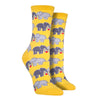 Shown on leg forms, a pair of women's Socksmith brand cotton crew socks in yellow with an all over design of 2 elephants linking trunks with a little red heart between them.
