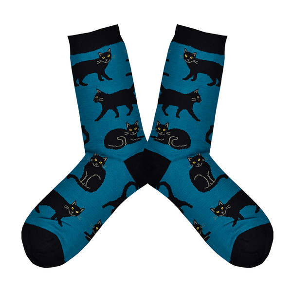 Shown in a flatlay, a pair of Socksmith brand women's bamboo crew socks in navy with a black heel, toe, and cuff. This sock features an all over design of black cats.