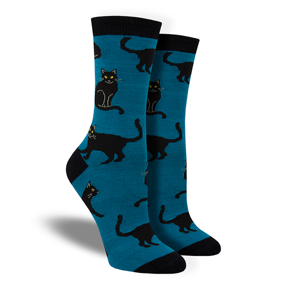 Shown on leg forms, a pair of Socksmith brand women's bamboo crew socks in navy with a black heel, toe, and cuff. This sock features an all over design of black cats.