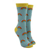 Shown on leg forms, a pair of Socksmith brand women's bamboo crew socks in light blue with a yellow toe, heel, and cuff. This sock has an all over motif of little rainbows.