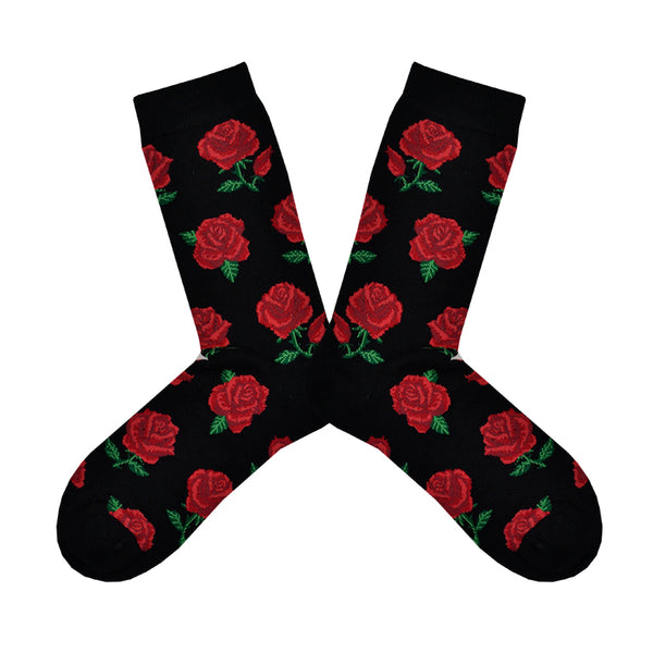 Shown in a flatlay, a pair of Socksmith brand women's bamboo crew socks in black. This sock has an all over motif of red roses with green leaf accents.