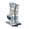 Shown on a leg form, a pair of Socksmith’s gray cotton women’s crew socks with various cats sitting like loaves and morphing into bread