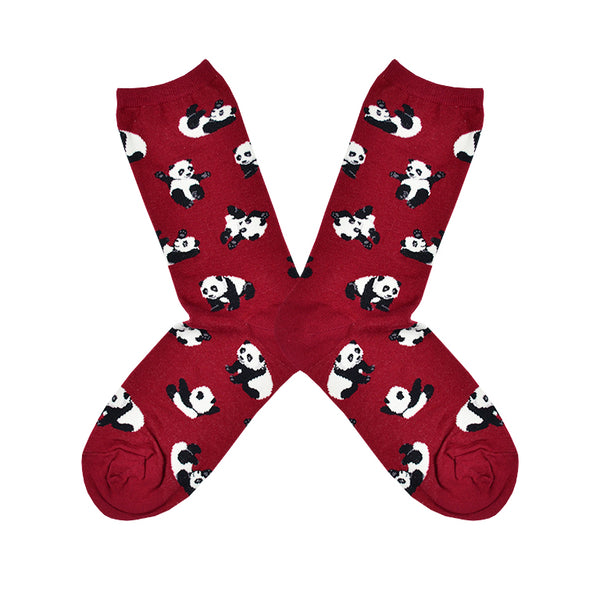 Shown in a flatlay, a pair of women's Socksmith cotton crew socks in red with an all over motif of little pandas rolling around.