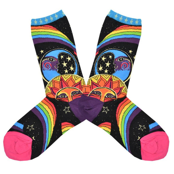 A pair of black socks with a pink toe, purple heel and, a blue cuff with white stars. These multi-colored socks feature popular motifs from the 60's artist Laurel Burch such as a sun and moon in bright blues and oranges. The designs are framed by rainbows and stars. 