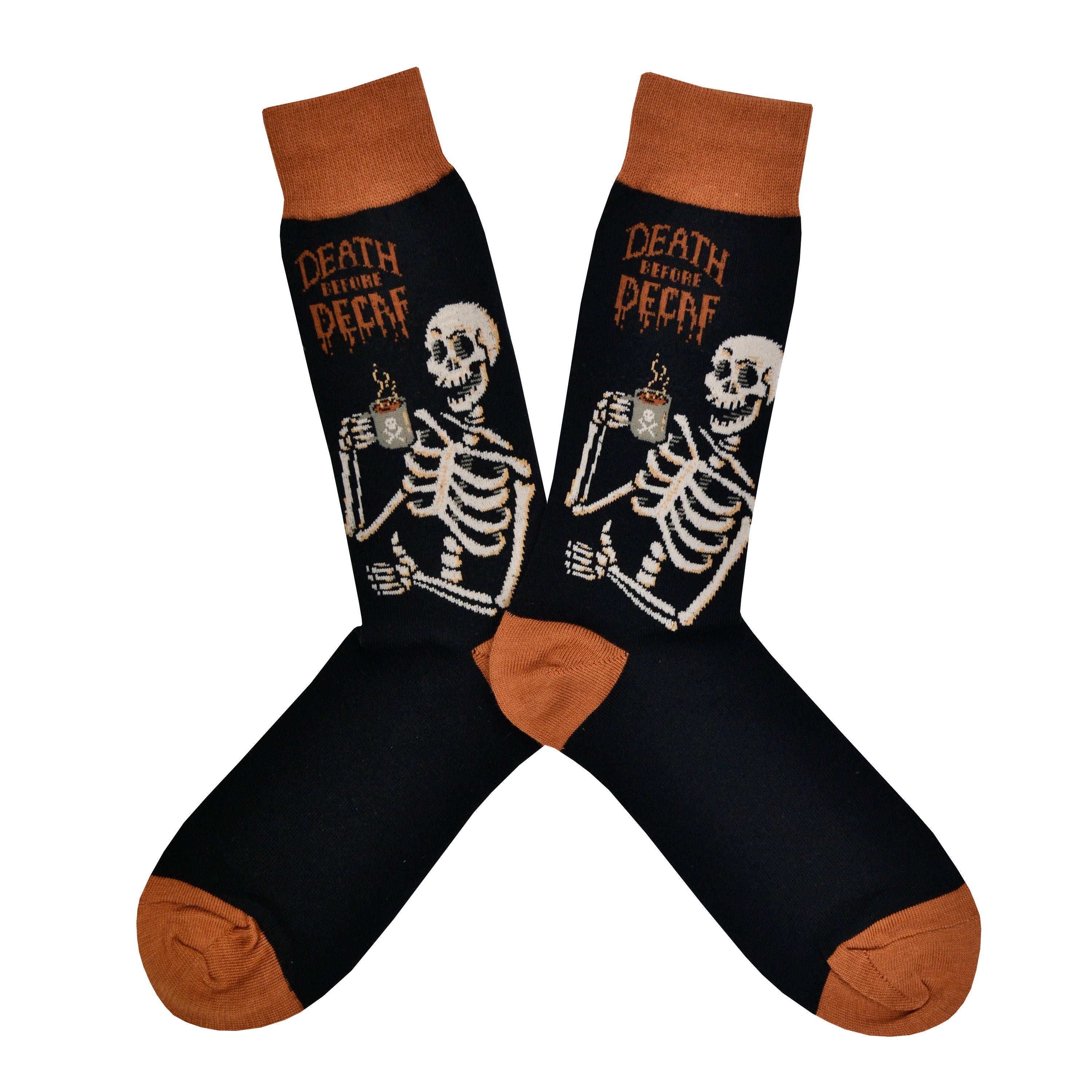 Shown in a flatlay, a pair of Socksmith's black cotton men's crew socks with brown cuff/heel/toe and a skeleton drinking coffee along with the words “Death Before Decaf”