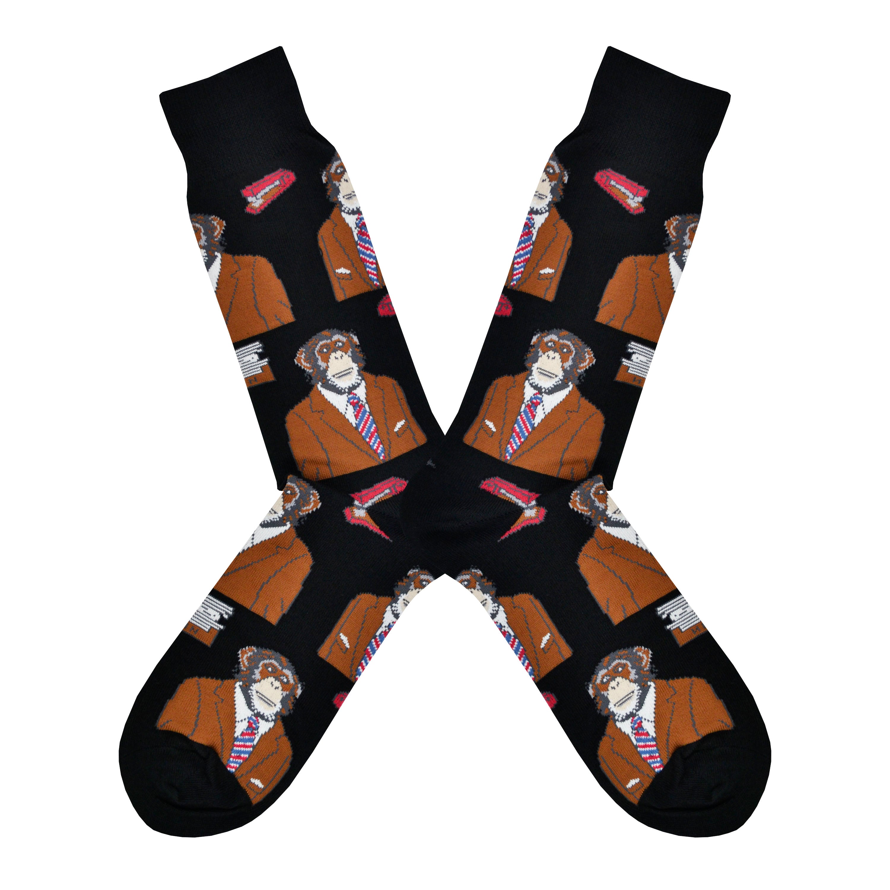 Shown in a flatlay, a pair of Socksmith men's black cotton crew socks with black cuff/heel/toe featuring an all over design of a monkey in a suit and tie.