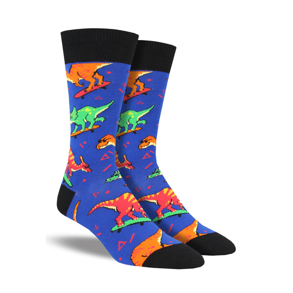 Dinosaurs wearing sunglasses are shown skateboarding all over a blue background for this men's cotton crew sock by Socksmith.