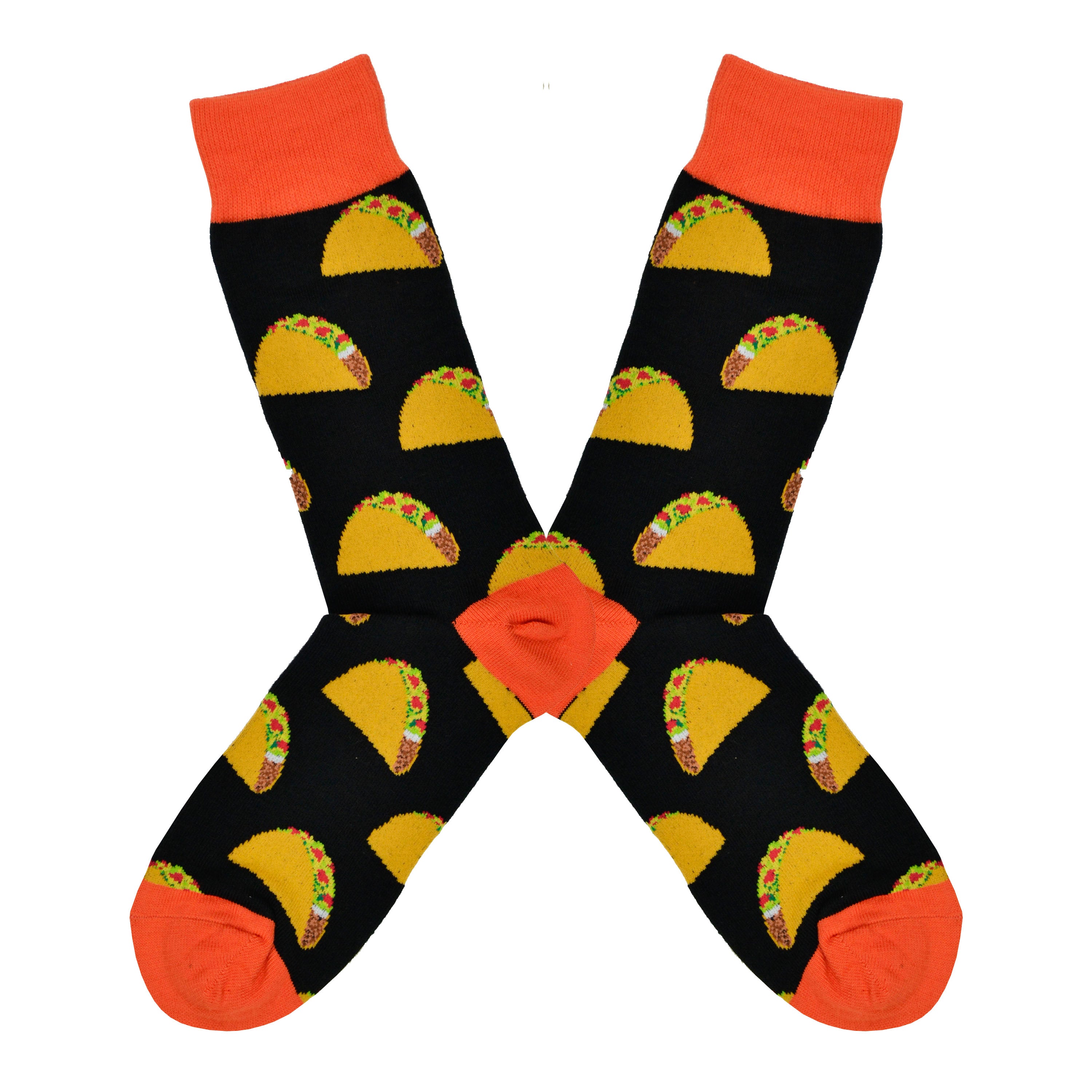 Shown in a flatlay, a pair of Socksmith's black cotton men's crew socks with orange cuff/heel/toe and all-over pattern of delicious hardshell tacos