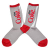 Shown in a flatlay, a pair of Socksmith brand women's cotton crew socks in grey with a red heel, toe, and cuff. The leg of the sock features the iconic Diet Coke Logo.