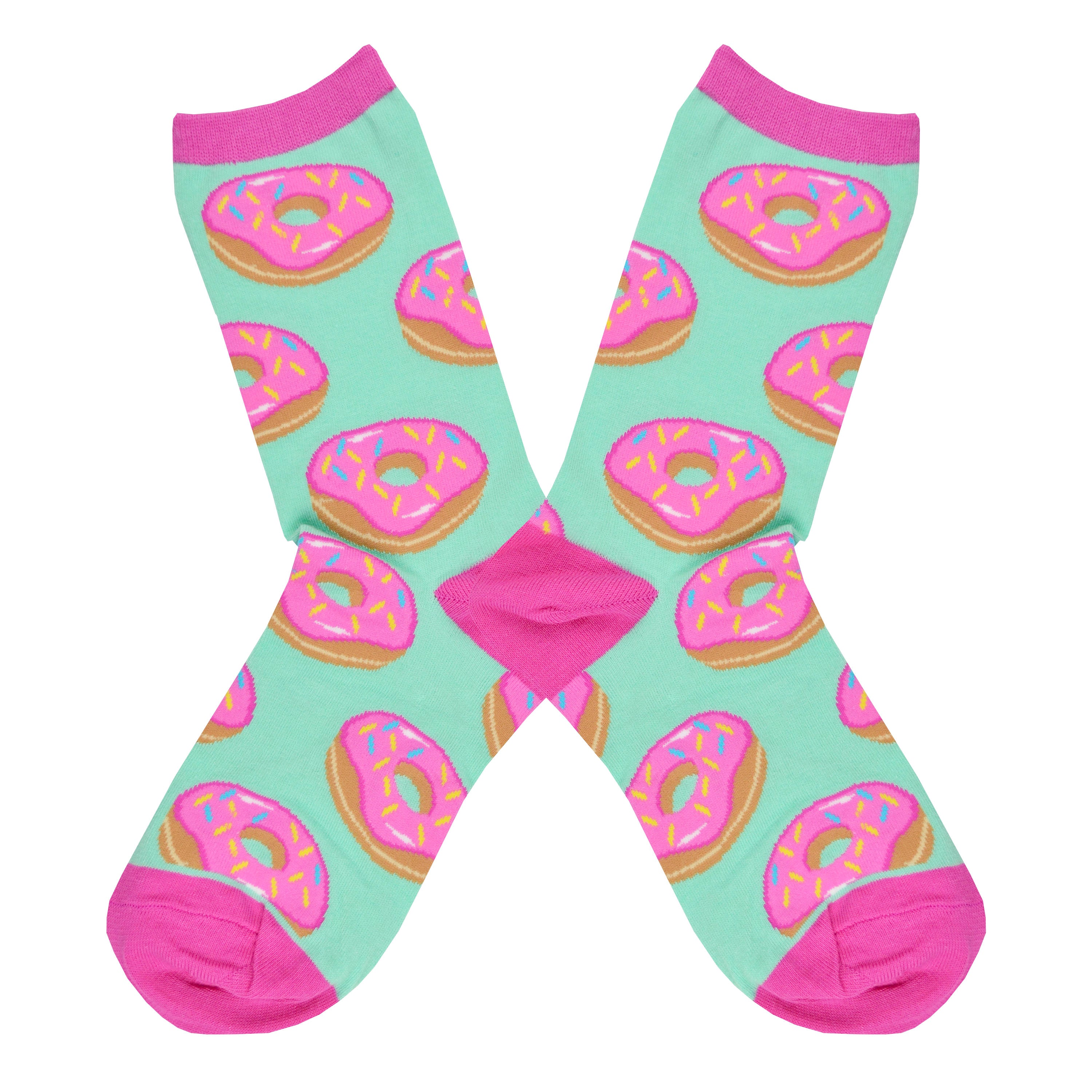 Shown in a flatlay, a pair of women's Socksmith brand cotton crew socks in seafoam green with a hot pink heel, toe, and cuff. The sock has an all over motif of pink frosted donuts.