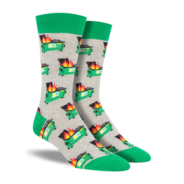 Shown on a foot form, a pair of Socksmith's black cotton men's crew socks with  lime green cuff/heel/toe and all over pattern of burning dumpsters