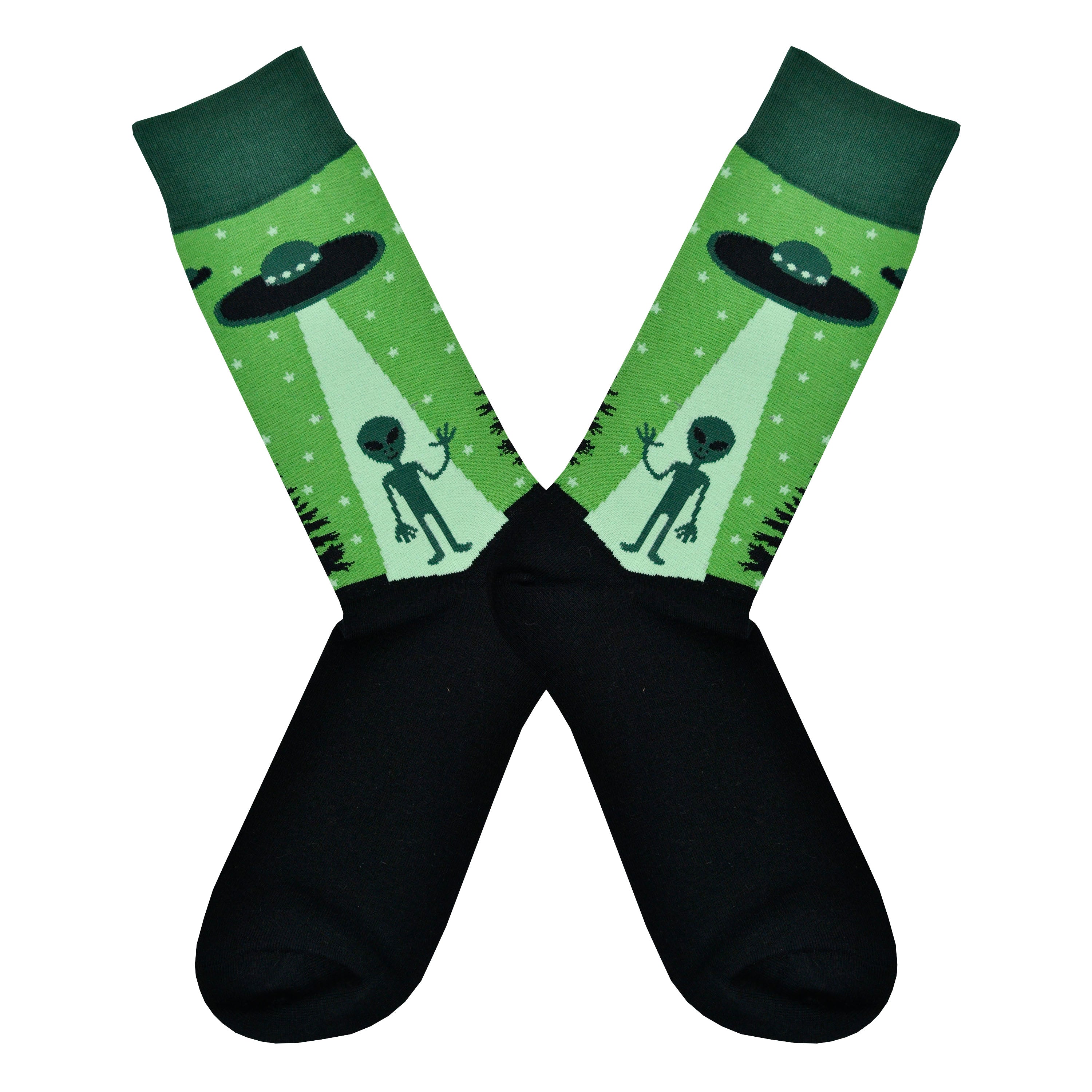 Shown in a flatlay, a pair of Sock It To Me green cotton men's crew socks with alien waving goodbye as it gets sucked into a UFO