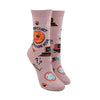 Shown on a leg form, these pink glittery women's crew socks by the brand Sock it To Me feature the words Mercury in Retrograde on the leg with small images of things going wrong throughout, like spilt coffee, a computer crashing and red stop lights.