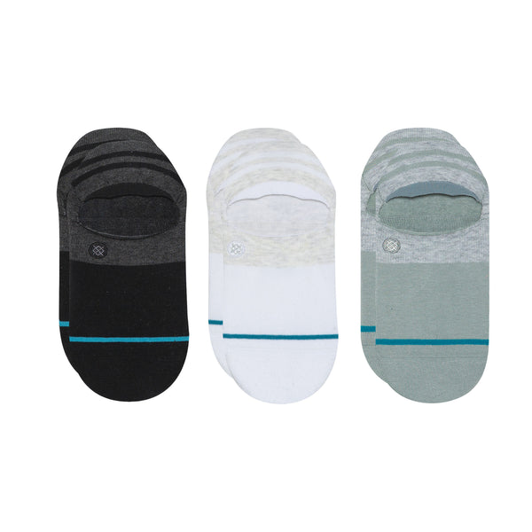 Shown in a flatlay, three pairs of Stance cotton men’s ped socks in gray, white and black