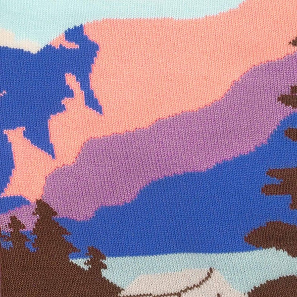 A detail shot of the pattern, color, and weft of the sock showing the light blue, pink, purple, and blue details.