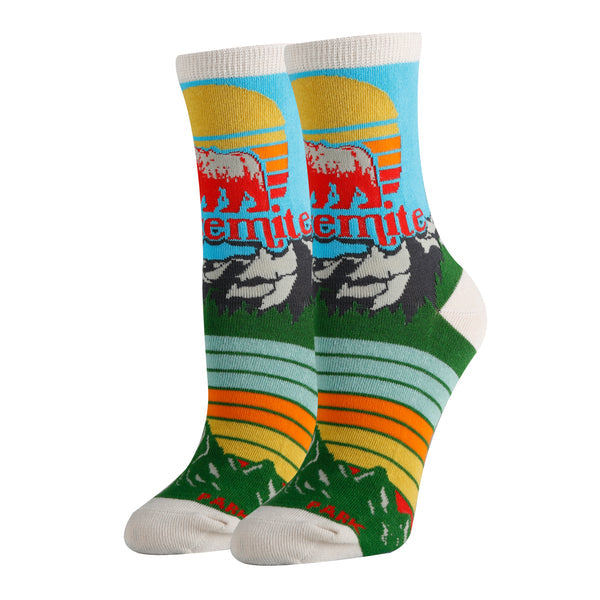 Shown on leg forms, a pair of small unisex crew socks. These socks feature the California bear with 