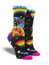 Shown on leg forms, a pair of black socks with a pink toe, purple heel and, a blue cuff with white stars. These multi-colored socks feature popular motifs from the 60's artist Laurel Burch such as a sun and moon in bright blues and oranges. The designs are framed by rainbows and stars.