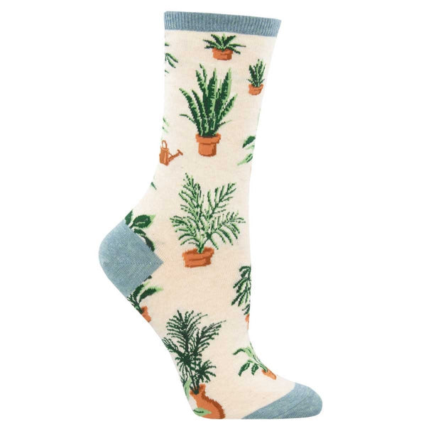 Shown on leg forms, a pair of women's Socksmith brand cotton crew socks in ivory heather with a blue heather heel, toe, and cuff. This sock features an all over motif of various leafy potted plants.