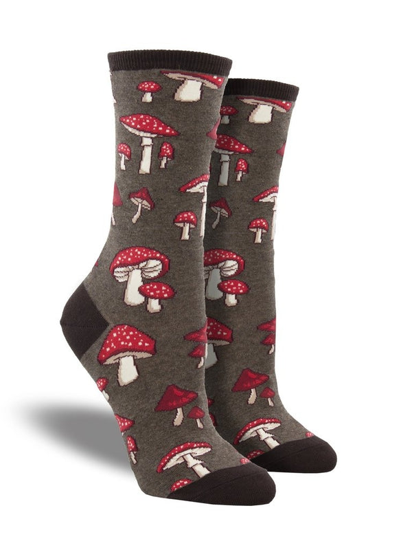 Shown on a leg form, these heather brown cotton women's crew socks by the brand Socksmith feature cute little mushrooms with red caps and white spots.