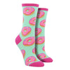 Shown on leg forms, a pair of women's Socksmith brand cotton crew socks in seafoam green with a hot pink heel, toe, and cuff. The sock has an all over motif of pink frosted donuts.