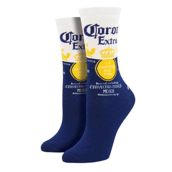 Shown on leg forms, a pair of Sock Smith brand women's cotton crew socks in blue and white featuring the Corona Extra label on the leg.