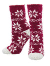Women's fuzzy socks on legs forms in red with a classic holiday fair isle design in white. 