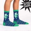 gif of blue socks on a childs legs showing how the white dinosaur bones on the sock glow in the dark or under UV light