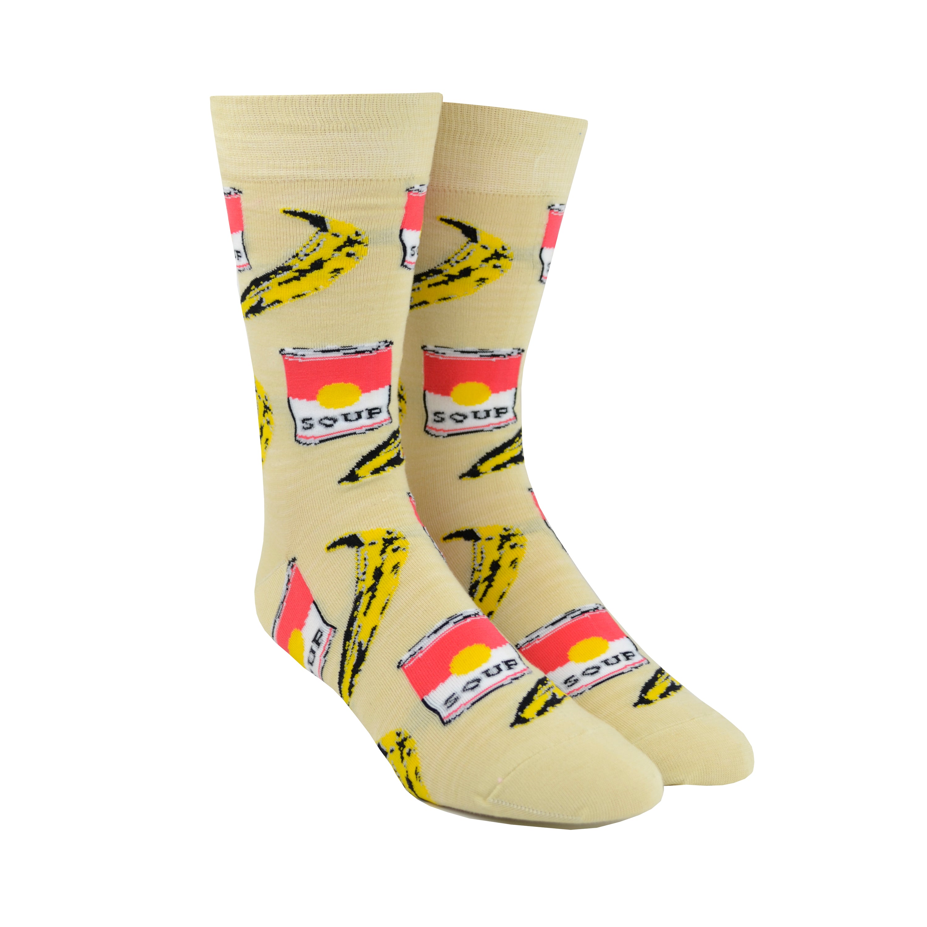 Shown on a foot form, a pair of Yellow Owl Workshop’s tan nylon-cotton men's crew socks with browning bananas and red soup cans