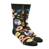 Shown on a foot form, a pair of Yellow Owl Workshop’s earthy brown nylon-cotton men's crew socks with colorful eggs, bacon, cereal, and milk pattern