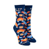 Shown on leg forms, a pair of women's Yellow Owl Workshop brand cotton and nylon socks in navy blue with orange and blue rainbow shelled turtles and orange daisies and the words "Free To Be Me" along the cuff.