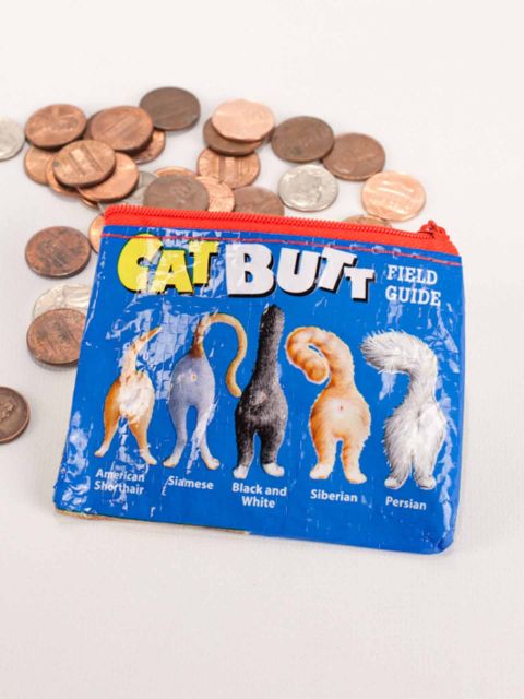 A small blue coin purse with a red zipper featuring 5 different cat butts spilling out change on a white background. The text along the top reads, "Cat Butt Field Guide". The bottom text below each cat butt reads, "American Shorthair, Siamese, Black and White, Siberian, Persian".