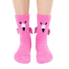 a pair of feet wearing pink fuzzy socks with little 3D wings, beak, and black embroidered eyes