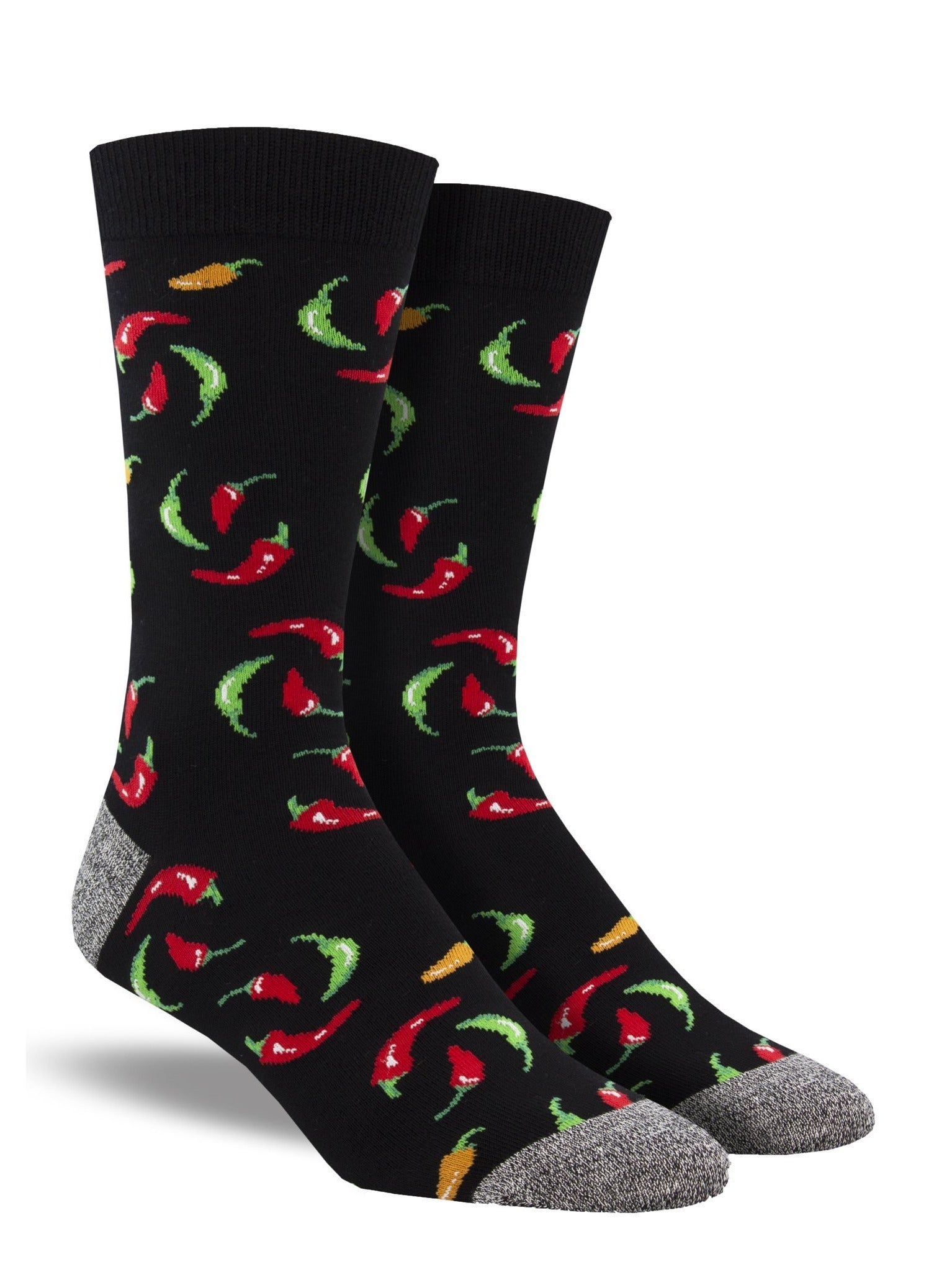 Shown on a leg form, a pair of Socksmith's bamboo men's crew socks in black with red, yellow and green hot chili peppers