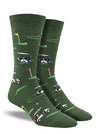 Shown on a foot form, a pair of Socksmith's dark green cotton men's crew socks with golf hole markers and golf carts in an all-over pattern