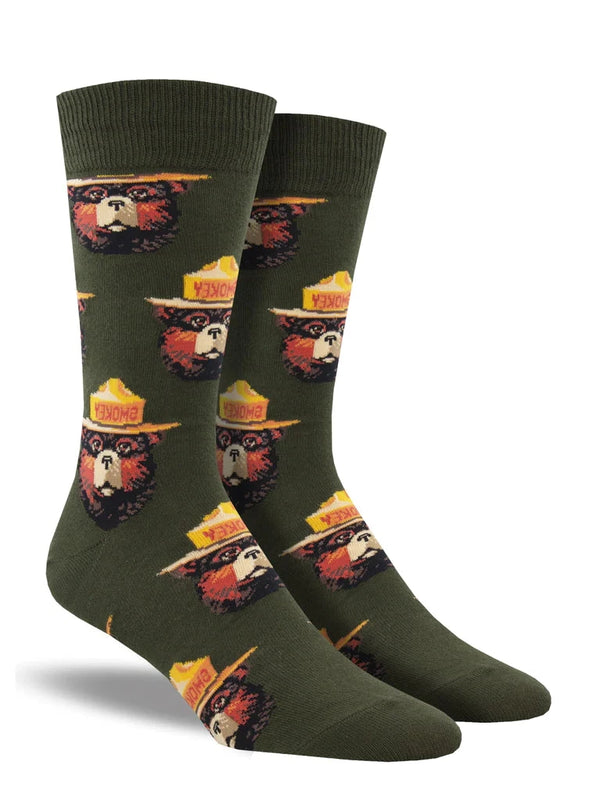 Forest green socks featuring several instances of Smokey Bear's head