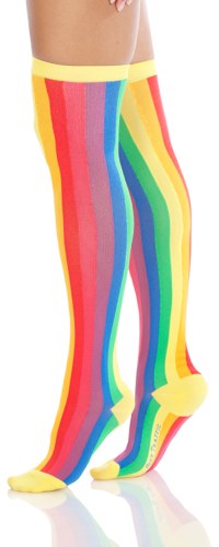 Vertical rainbow striped cotton women's over the knee socks with a yellow toe and cuff are shown on a model.